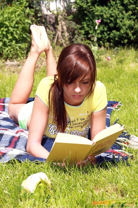 Teen lesbians lick and toy pussies atop a blanket out on the lawn 70879041