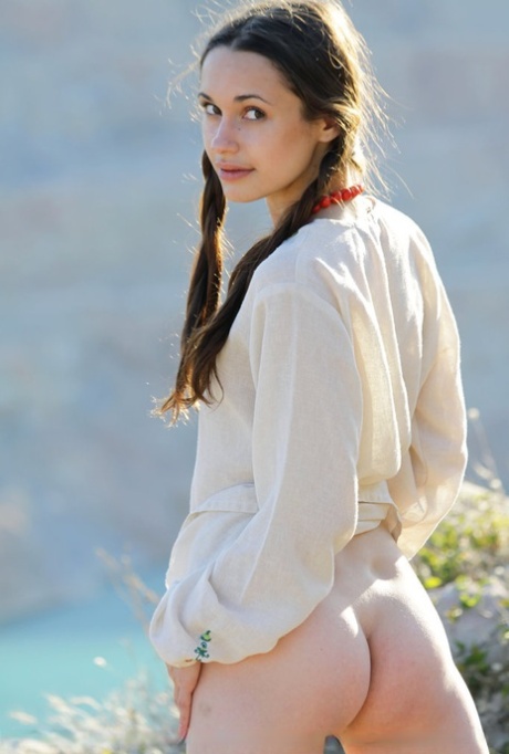 Teen model Ilona B poses nude in pigtails high above ocean waters 39036849