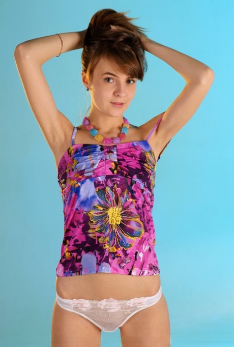 Cute teen Martha A kicks off her white panties to model completely naked 54581414