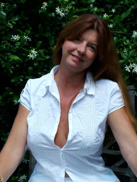Older lady Dee Delmar pulls out her big boobs as she strips naked 50257885