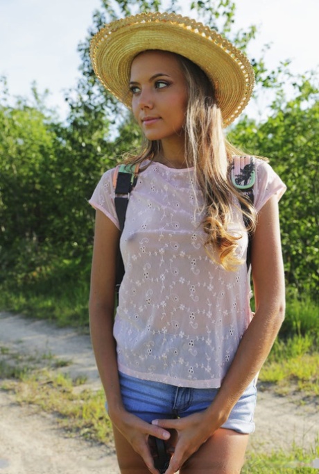 Country girl Mango A loses her shorts to crawl around nude in the sunny field 28148145