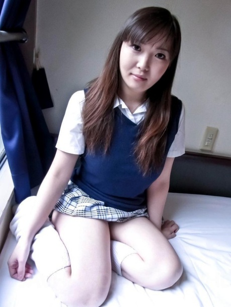 Japanese coed Haruka Ohsawa unveils her full breasts while kneeling 14161530