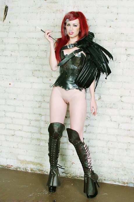 Tattooed redhead Crash smokes while wearing leather fetish clothing 56134731