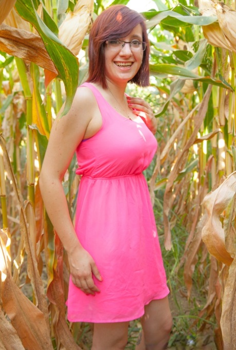 Big titted amateur Chelsea Bell disrobes in a corn field to reveal huge melons 67622427