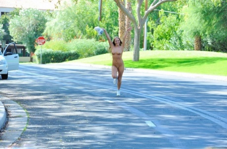 Amateur girl strips to her sneakers before jogging down a street in the nude 95263848