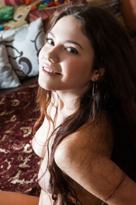 Long haired teen Norma Joel strikes great nude poses on top of her bed 96984950