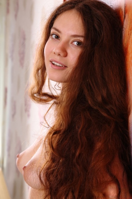Young looking girl Norma A lays naked on her bed after removing her dress 57407249