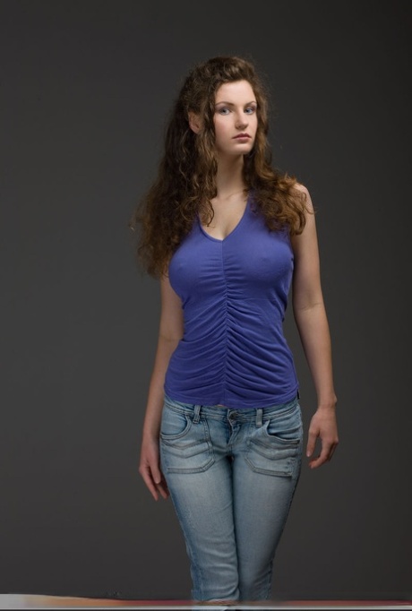 Slender busty Susann doffs her jeans to pose nude fondling her sexy big tits 50977439