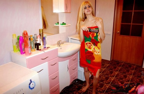Blonde teen wraps herself in a bath towel during a non-nude shoot 15170578