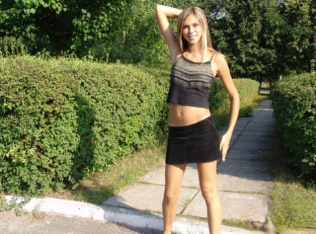 Long legged blonde teen Katrina teases in a miniskirt while in public 29560889