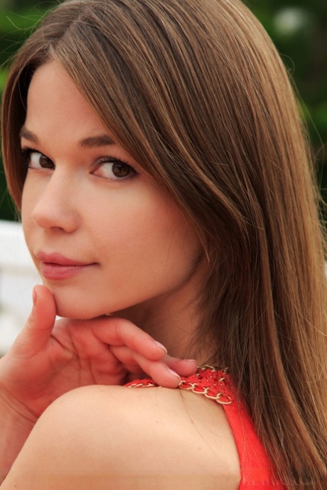 Beautiful teen Nedda A displays her trimmed muff after undressing in garden 13997713