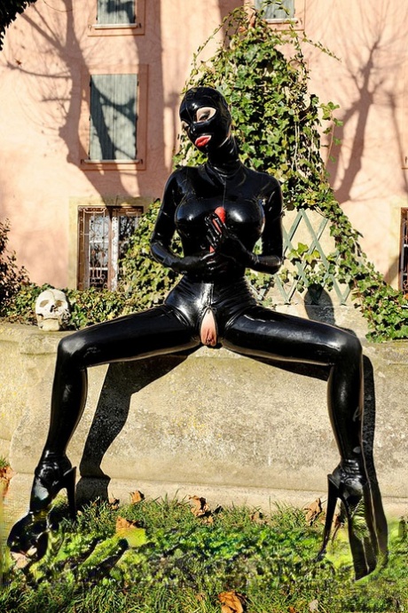 Latex adorned fetish babe Lucy Latex toying and masturbating outdoors 84153401
