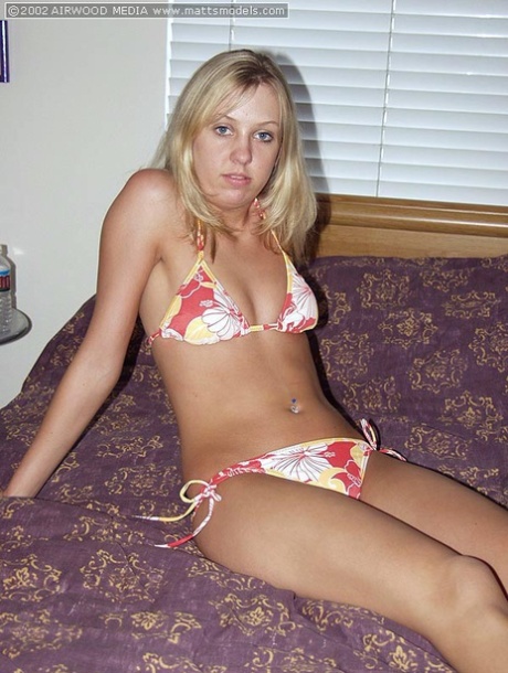 Blonde amateur Sierra doffs a bikini before parting her pink pussy on a bed 10717919