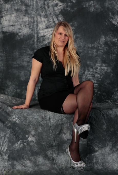 Older blonde Sweet Susi looses her natural tits and snatch from a black dress 23974030