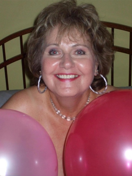 Older lady Busty Bliss plays with balloons before uncupping her natural tits 99018356