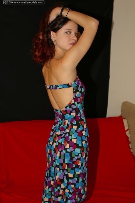 Young girl Iris slips off a dress for her first nude poses on a futon 40525000