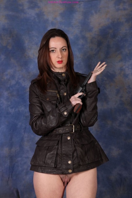 Bottomless female works clear of black leather jacket during solo action 81137083