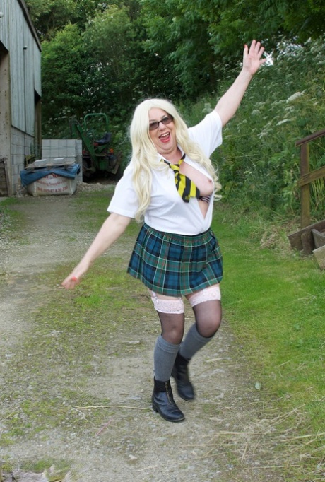 Old UK amateur Barby Slut exposes herself on a playground in schoolgirl attire 15281353