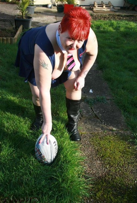 Fat redhead Valgasmic Exposed exposes her tits while playing with a football 21194909