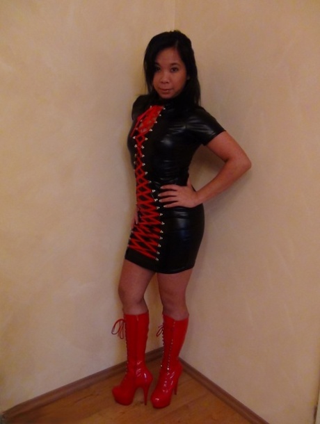 Beautiful Asian female in hot latex and high heel boots flashes sexy upskirt 99304289