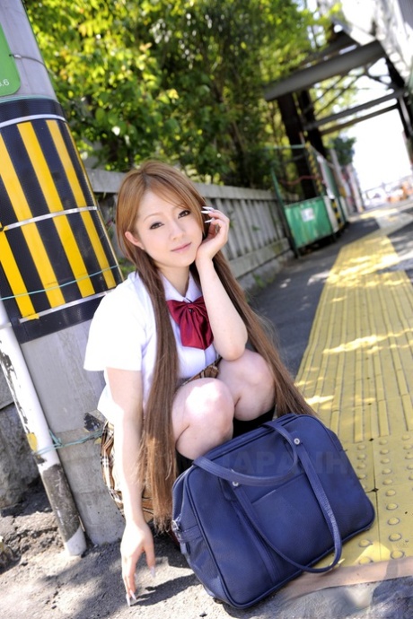 Innocent Japanese schoolgirl Ria Sakurai flashes sexy white panties in public 74003681