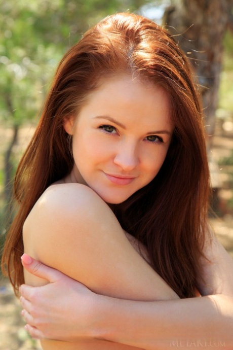 Redhead teen Alice May showcases her bald pussy on top of picnic table in park 82158467