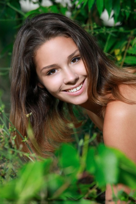 Petite teen Arina F removes black bra and panty set in front of undergrowth 98448137