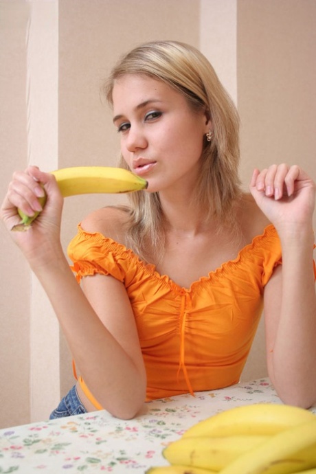 Blonde amateur peels off her clothes before doing the same to a banana 60877566