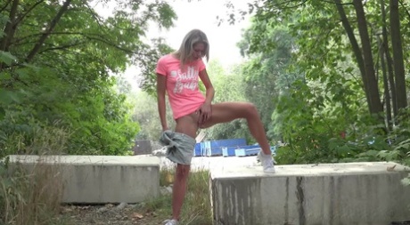 Blonde girl Claudia Macc gets caught taking a badly needed pee out in nature 15704064