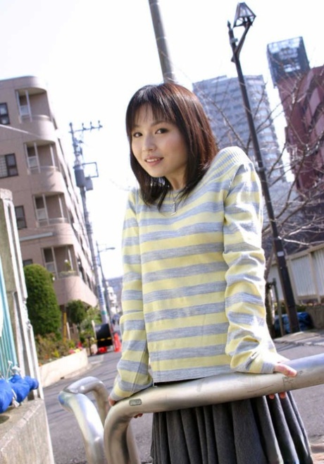 Young Japanese girl Kanan Kawaii flashes upskirt panties before getting naked 76105029
