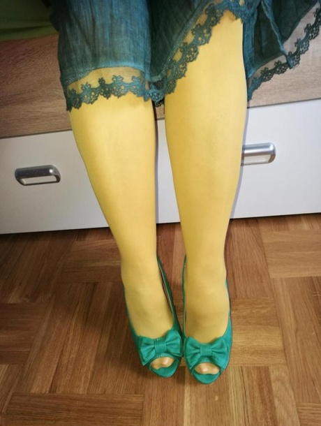 Old woman Caro releases her hairy vagina from yellow pantyhose on her bed 54786490