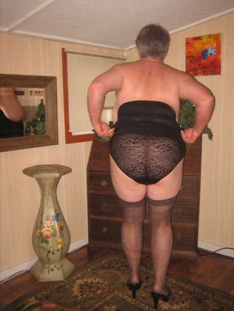 Fat old woman Girdle Goddess doffs black lingerie to pose nude in stockings 77836289