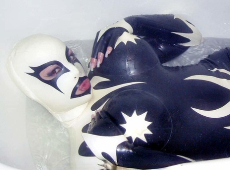 Caucasian fetish model wears head to toe latex clothing while bathing 20680671