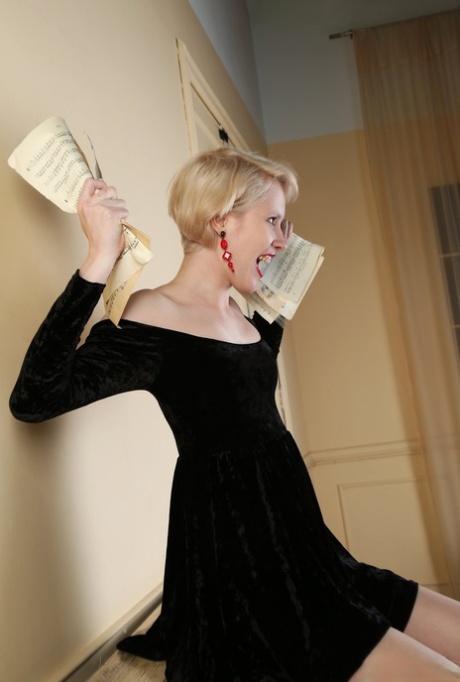 Fair skinned teen with blonde hair and red lips doffs black dress to pose nude 80650182