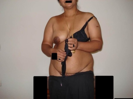 Overweight Indian woman takes a seat after stripping off her clothing