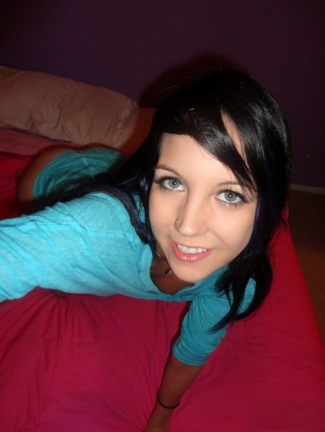 Brunette teen Andi Land takes self shots of her natural tits and bald slit 23111307