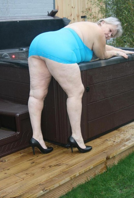 Fat granny hikes up see thru dress to expose her vagina in black pumps 60458035