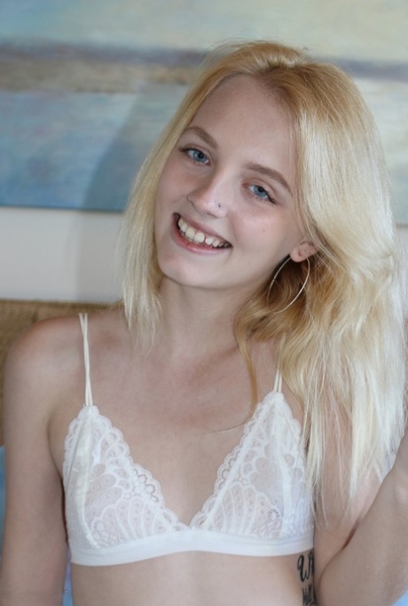Petite blonde Kate Bloom parts her wet pussy after getting naked on her bed 44615229