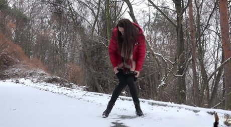 White girl Cynthia Vellons pulls down her leggings to pee on a snowy ground 59262205