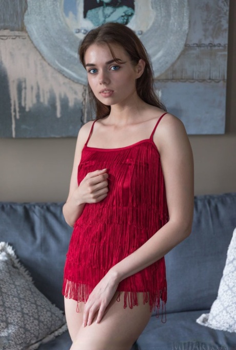 Nice teen Keira Blue uncovers her still budding boobs as she gets totally nude 69708458