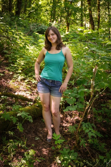 Amateur chick uncovers big naturals before playing with her beaver in woods 26186047