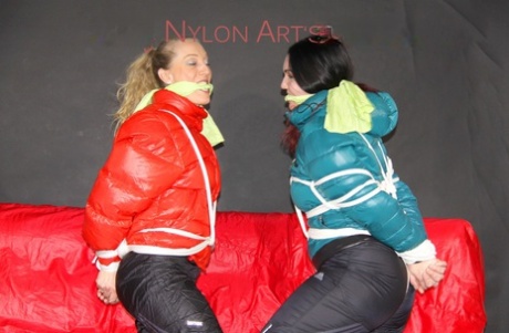 Two white girls are left tied up and gagged in winter coats and nylon pants 13971371