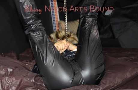 Caucasian chick is gagged and restrained in a winter coat and nylon pants 36462549