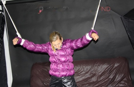 Solo girl finds herself gagged and tied up in a purple down jacket 68926207
