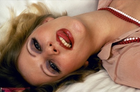 Pornstars from the 70s with red lips indulge in lesbian sex acts 52046191