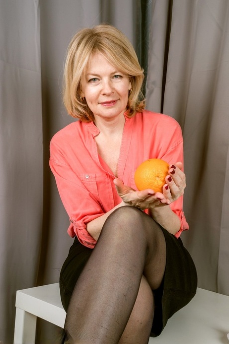 Sexy older lady Diana V plays with her shaved pussy as she gets totally naked 90777696
