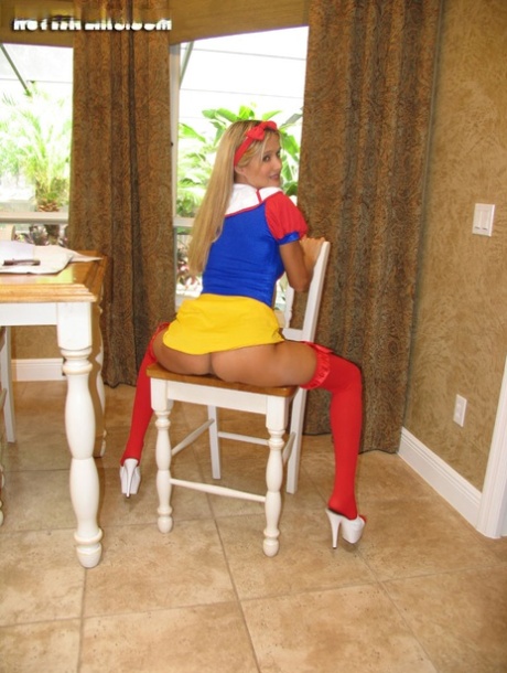 Blonde amateur changes into cosplay attire at a kitchen table 46086495