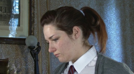 Caucasian student rubs her sore ass after receiving a caning 19151678