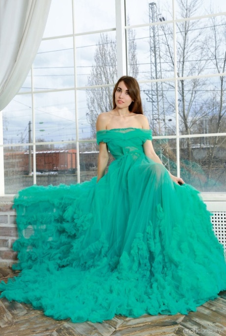 Nice teen Rosie Lauren removes an elegant gown to model in the nude 74012360