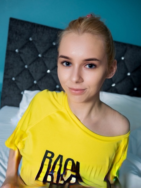 Young looking blonde Maya puts her hair up before posing nude in knee socks 76749930